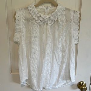 White sleeveless blouse